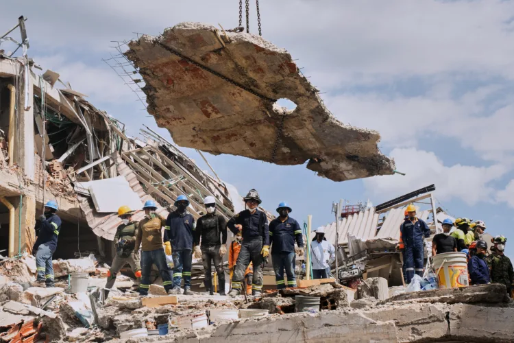 Signs of life emerge under earthquake debris